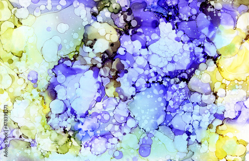 Abstract yellow-purple background. Exquisite fluid texture with the effect of mixed purple, blue and yellow colors. An exquisite mother-of-pearl shade of color.