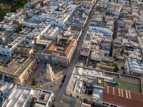Aerial view of the Tarantini square of Ginosa in South Italy with spectacular Torre dell Orologio monument.