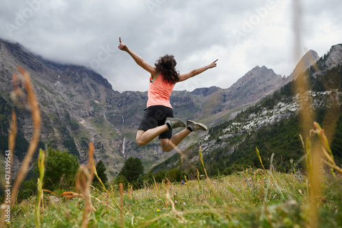 Anonymous person jumping in the field