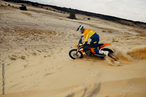 Wallpaper Mural Professional motocross rider sliding down sand hill Torontodigital.ca