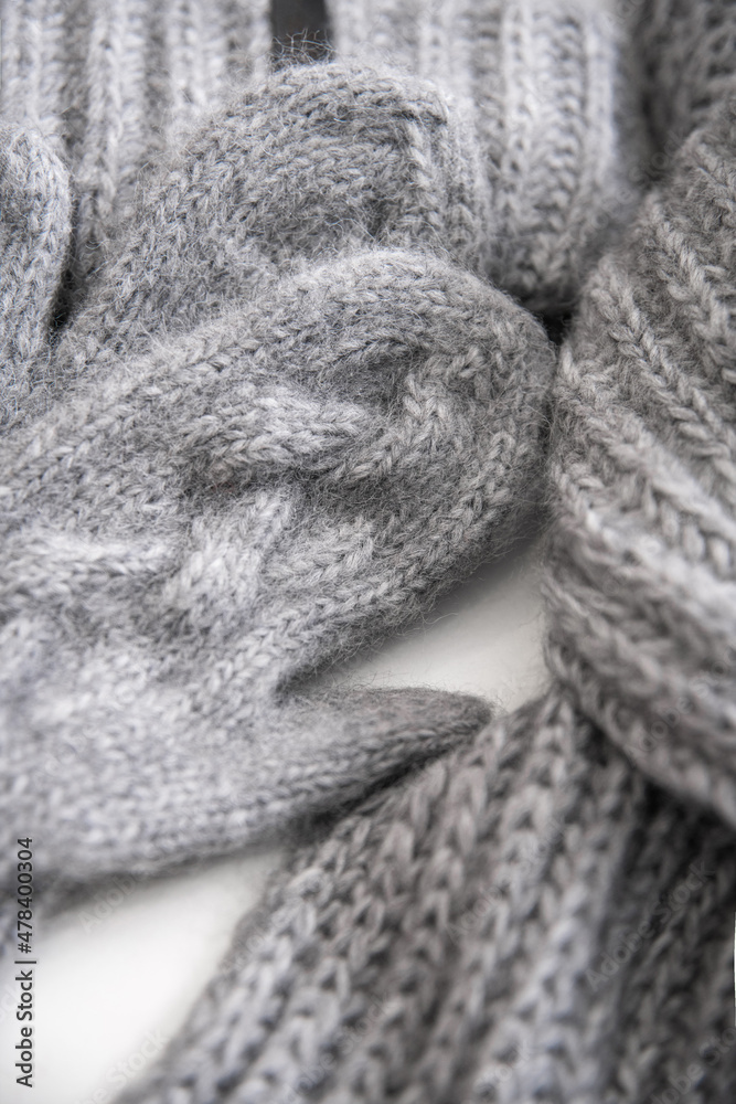 Fototapeta premium Knitted scarf gloves and hat
