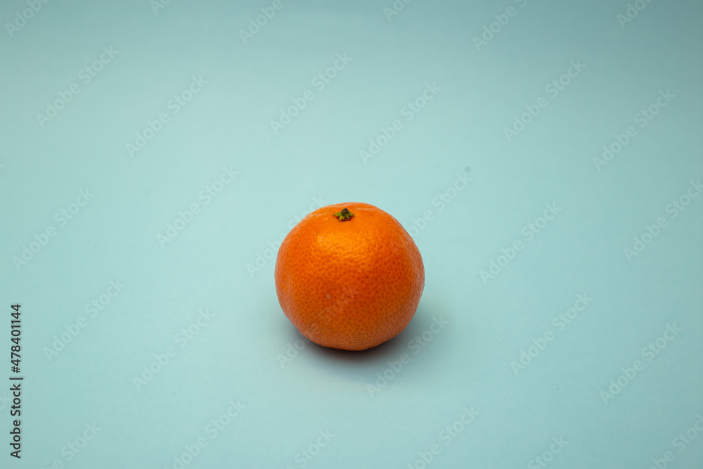 Fototapeta premium Bright candle stands on the background