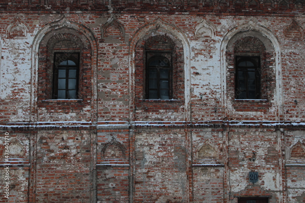 Wall of old red brick house with arch windows Wall of old red brick house with arch windows