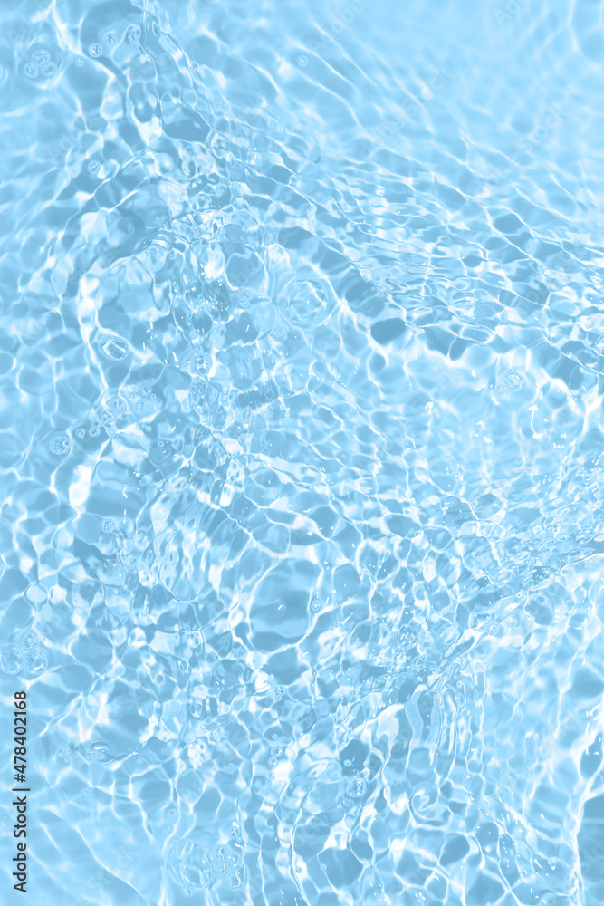 Fresh water background. Bright blue pattern with natural rippled water texture and bubbles. Top view with copy space. Clear water surface background.