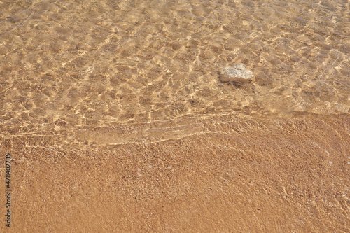 Waves on the tropical sandy beach of the red sea.