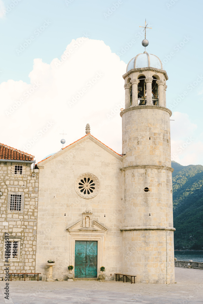 Bell tower and central entrance to the Church of Our Lady on the rocks on the island of Gospa od Skrpjela