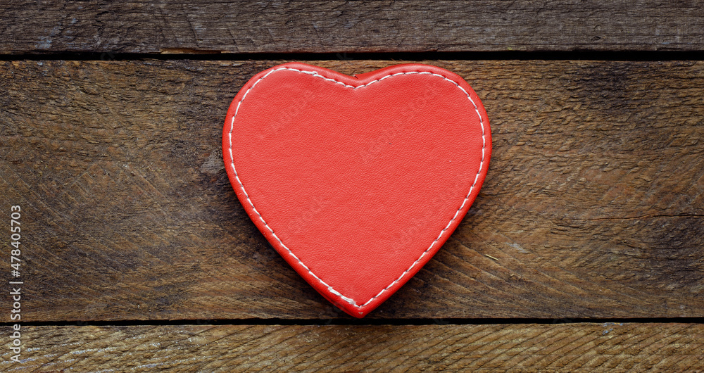Red heart on a wooden table. Red heart on a wooden table.