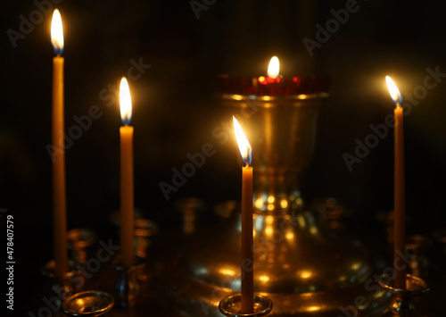 A large candlestick - a candlestick with burning candles in an Orthodox church.