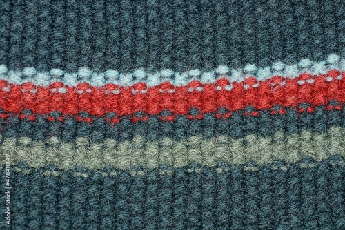 fabric texture of colored stripes on black wool clothes