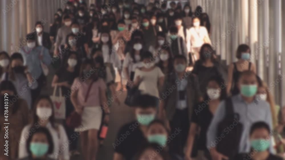Defocused, Large crowd of business people with medical face mask. Air pollution. Coronavirus, covid 19 quarantine, Defocused, Large crowd of business people with medical face mask. Air pollution. Coronavirus, covid 19 quarantine,