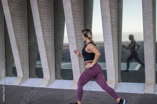 woman doing jogging reflected in the mirror