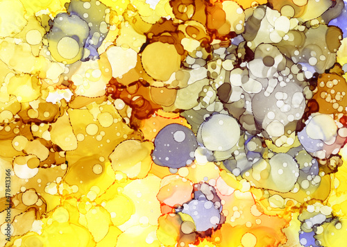 Abstract background of brown and yellow spots. Fluid background painted with alcoholic ink. An exquisite diffusion texture made of a mixture of bright transparent paint drops.