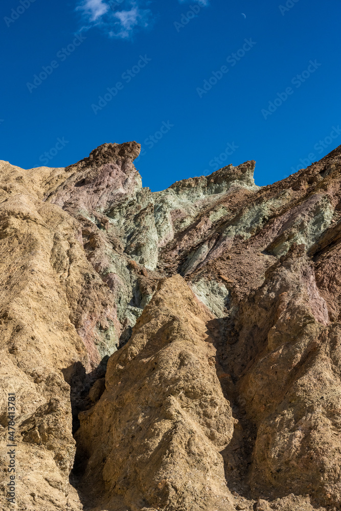 Multicolored Mountain Side Under a Blue Sky In Death Valley Multicolored Mountain Side Under a Blue Sky In Death Valley