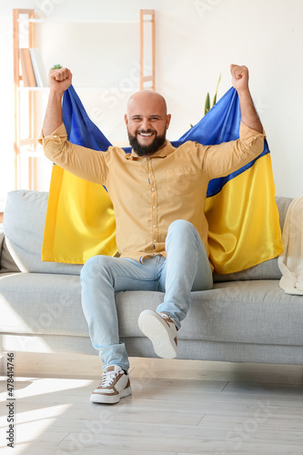 Handsome man with flag of U...