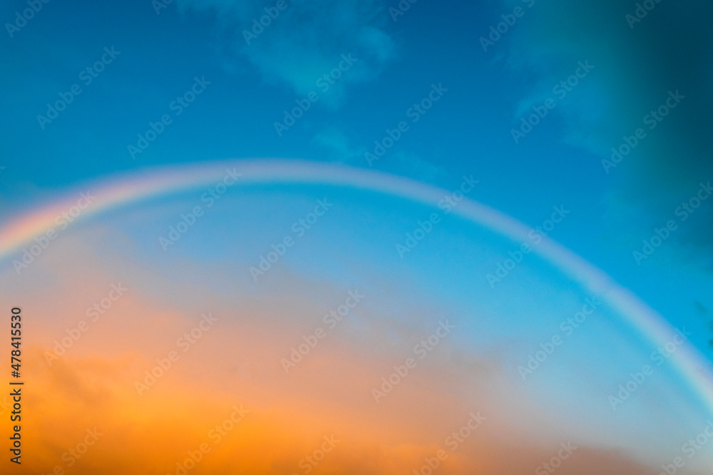 View the sky with rainbow in rural area of Guatemala, open space at sunset.