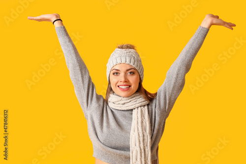 Happy young woman in warm w...
