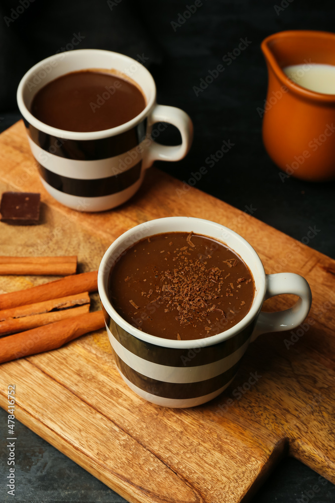 Cups of natural hot chocolate on black background Cups of natural hot chocolate on black background