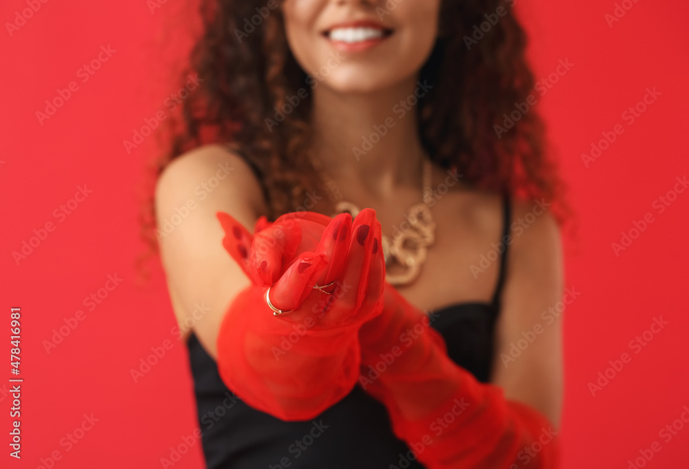 Elegant young woman with stylish gloves on color background, closeup Elegant young woman with stylish gloves on color background, closeup