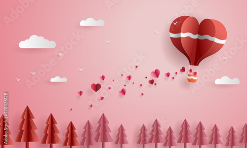 Foto Paper cut love and valentines day, Origami balloon float in the air scatter hearts over pine trees