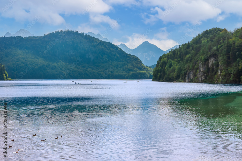 Schwansee lake among alpine mountains in Germany near Hohenschwangau Castle