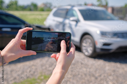 Driver hands taking photo on mobile phone camera after vehicle c photo