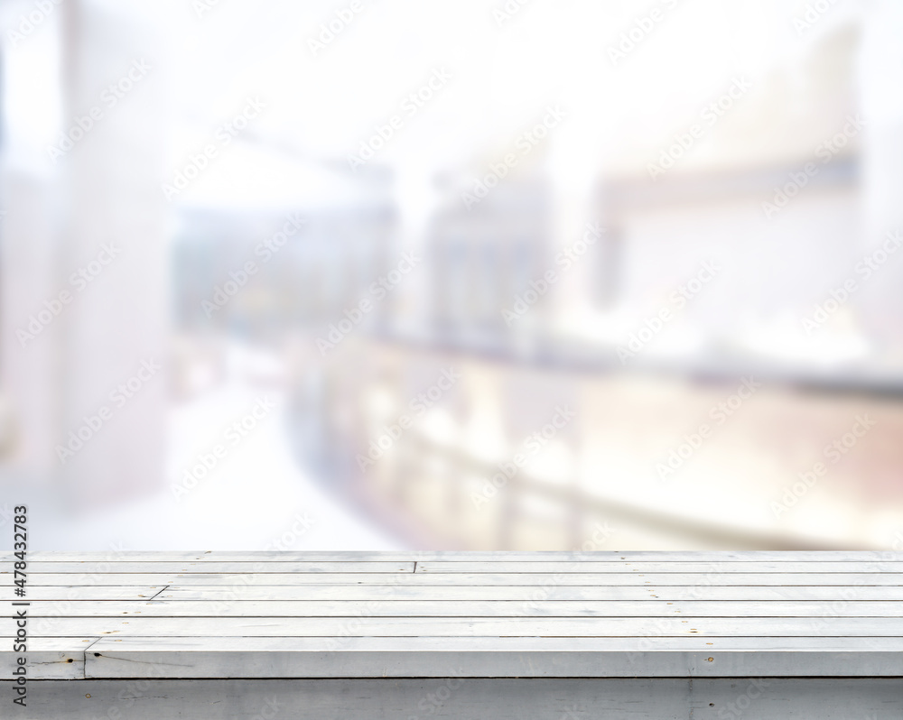 Empty white wooden tabletop with blur image of a counter bar in the hotel or bar interior Luxury lobby in the daytime background, copy space for your text ready for product promotion display montage Empty white wooden tabletop with blur image of a counter bar in the hotel or bar interior Luxury lobby in the daytime background, copy space for your text ready for product promotion display montage