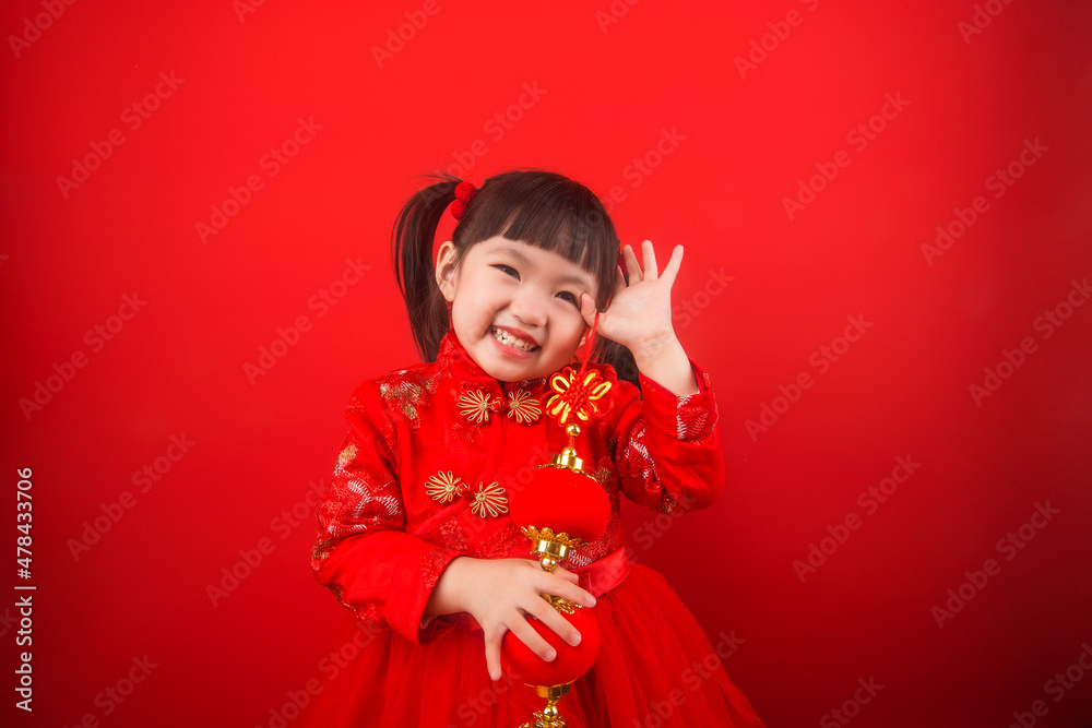 A girl celebrates Chinese New Year with a Chinese knot A girl celebrates Chinese New Year with a Chinese knot