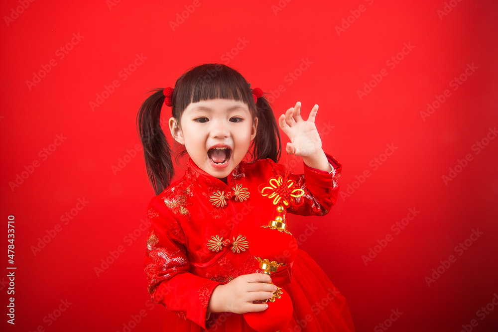 A girl celebrates Chinese New Year with a Chinese knot