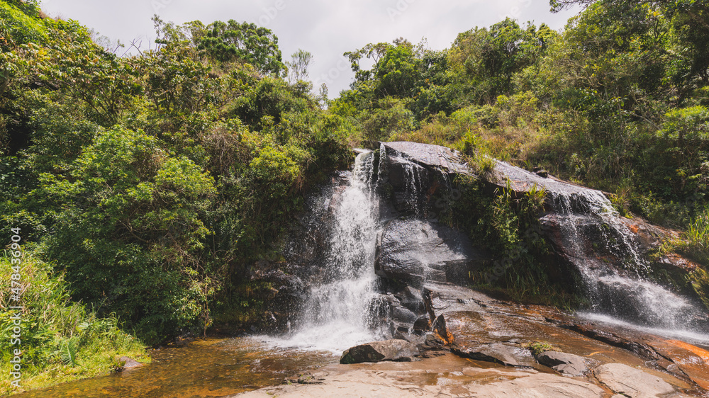 Beautiful waterfall under blue sky Beautiful waterfall under blue sky