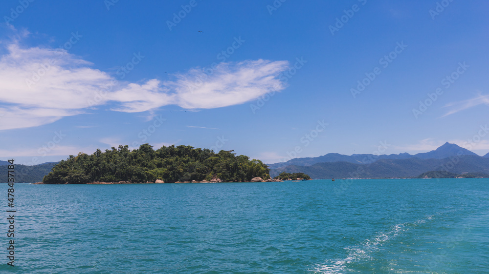 Island under blue sky in blue sea Island under blue sky in blue sea
