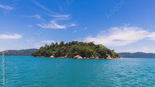 Island under blue sky in blue sea © MarcosP