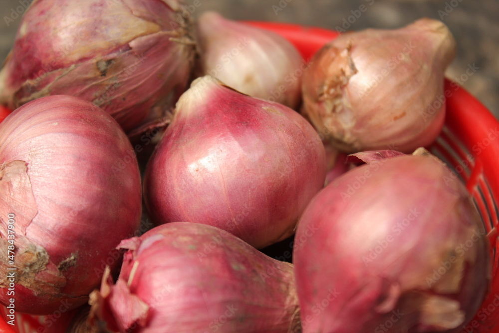 Bunch of fresh onions on a bowl Bunch of fresh onions on a bowl