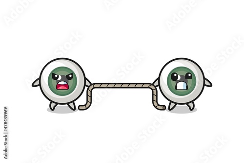 cute eyeball character is playing tug of war game