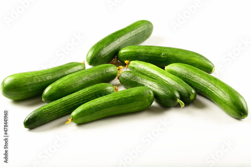 Fresh green  cucumbers on a white background. vegetarian raw foods.