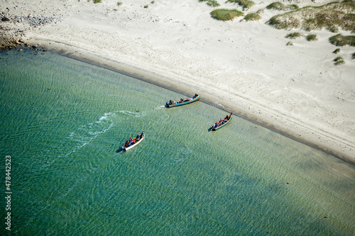 Inuit and Boats on a Beach Nunavik Quebec Canada photo