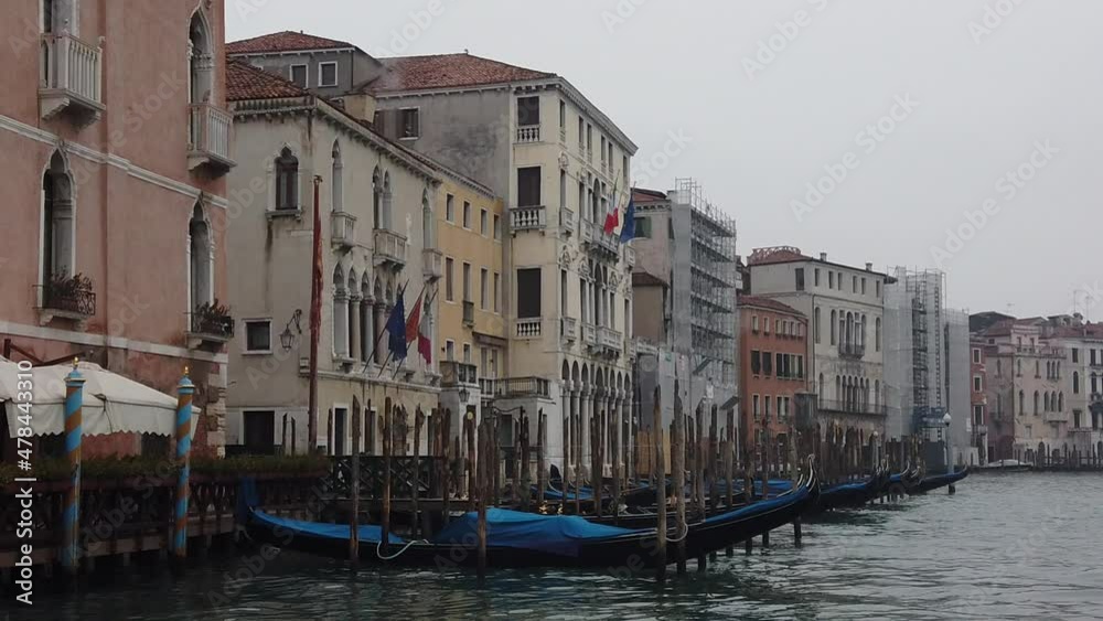 Venice, Italy - January 2022 - Traveling on the public transport boat, along the Grand canal, among the splendid historic buildings of the lagoon city Venice, Italy - January 2022 - Traveling on the public transport boat, along the Grand canal, among the splendid historic buildings of the lagoon city