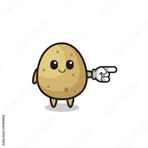 potato mascot with pointing right gesture
