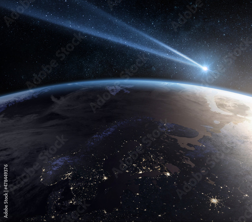 Fototapeta Naklejka Na Ścianę i Meble -  Comet, asteroid, meteorite flying to the planet Earth.  Glowing asteroid and tail of a falling comet threatening the safety of the Earth.  Elements of this image furnished by NASA.