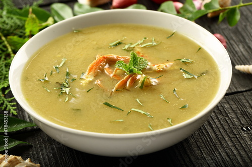 Seafood recipes- crab meat soup with fresh cream and exotic spices, herbs. 