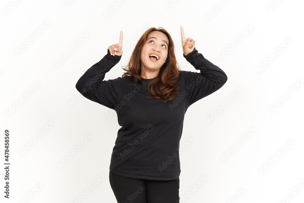 Showing Product And Pointing Up Of Beautiful Asian Woman Wearing Black Shirt Isolated On White Showing Product And Pointing Up Of Beautiful Asian Woman Wearing Black Shirt Isolated On White