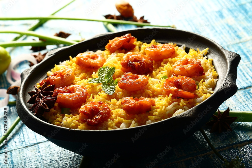 Indian street foods background- delicious seafood biryani cooked with prawns and shrimps.