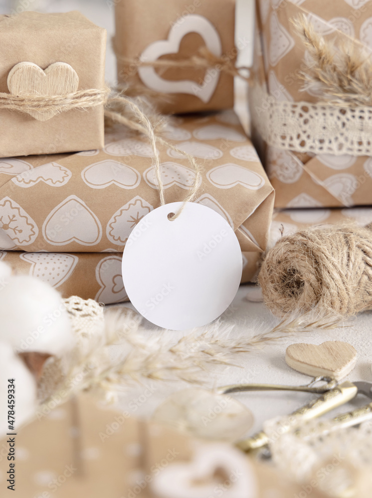 Valentines present with round blank gift tag close up, Rustic Mockup