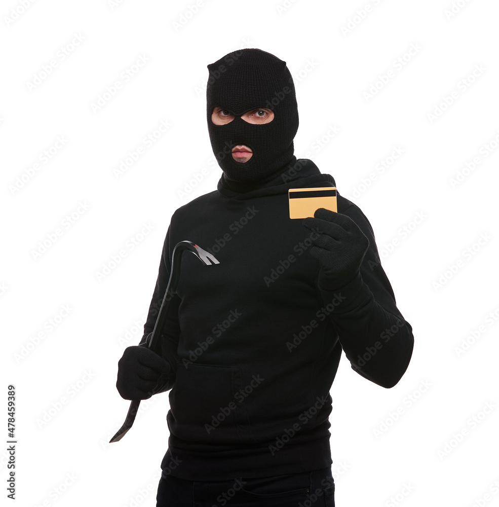 Thief in mask with crowbar and credit card on white background Thief in mask with crowbar and credit card on white background