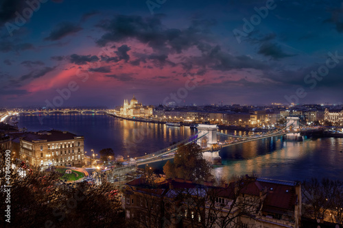 The illuminated Budapest skyline during dusk with the famous Chain Bridge along river Danube and the Parliament building, Hungary