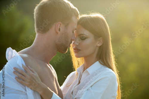 Sensual portrait of young couple in love. Loving couple embracing and kissing. © Volodymyr