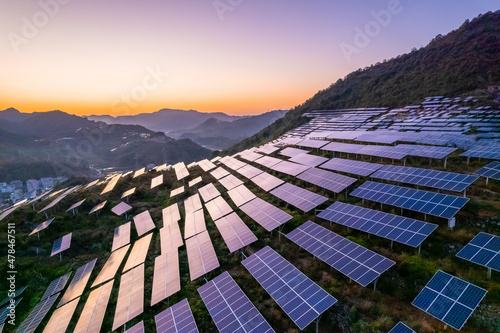 aerial view of solar power panels on hill