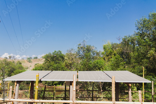 Solar cell panels systam close up  with blue sky and green tree and nature or landscape photo