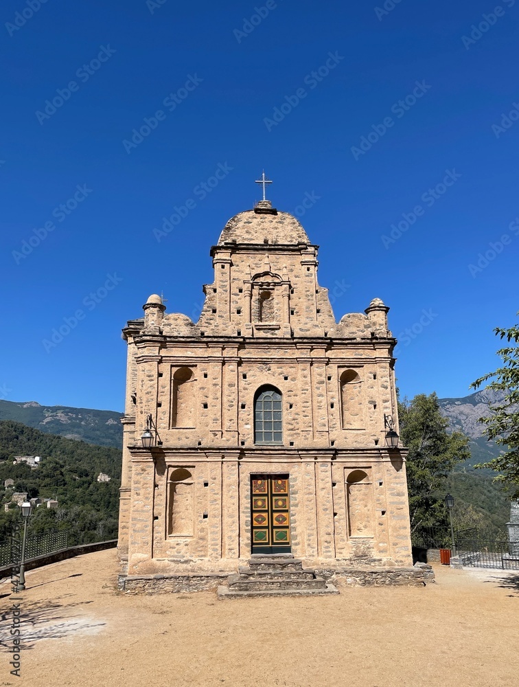 Front facade of Roman church Saint in Parata, Castagniccia. Corsica, France. Vertical.