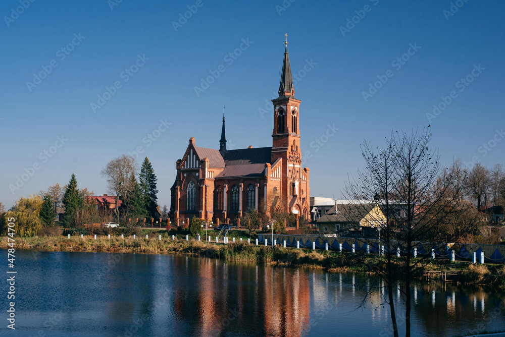 Red Gothic church on the river bank, Belarus