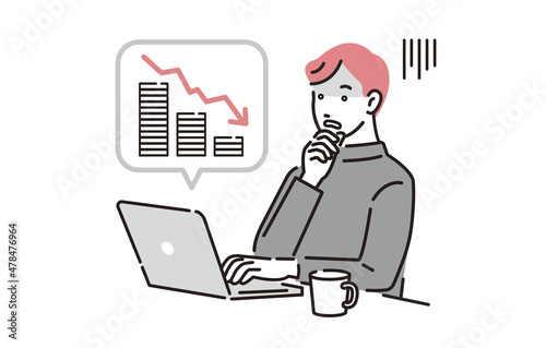 パソコンで資産運用をする男性
